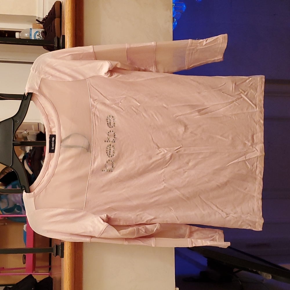 Bebe light pink top. Size Medium.